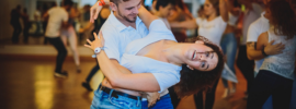 Couple dressed in white shirt and bluejeans dancing