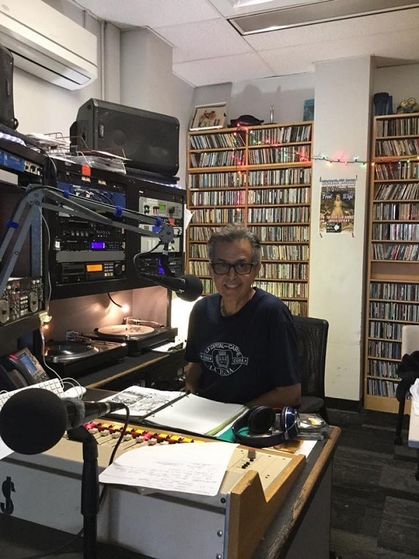 Eddie López working at the radio station