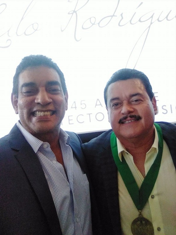 Tommy Olivencia Jr. next to Lalo Rodríguez