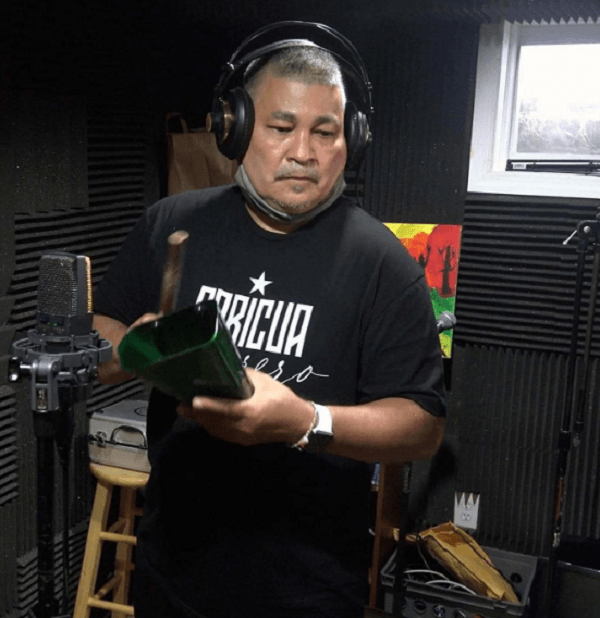Pocholo playing the cowbell