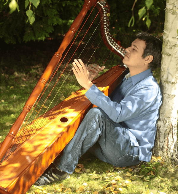 Ángel posing with the harp