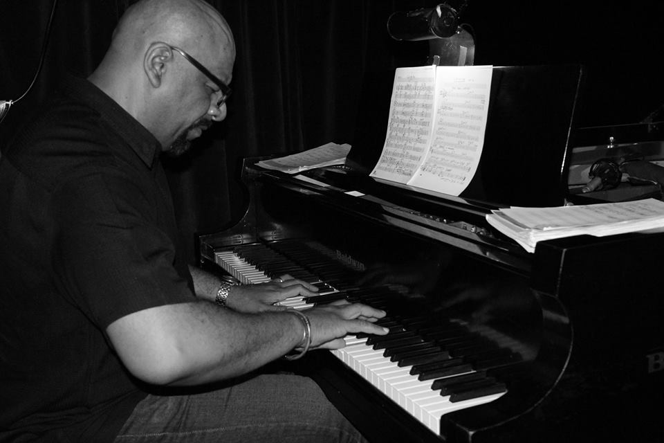 Luis Perdomo playing the piano