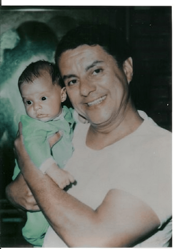 Tito Puente holding his son
