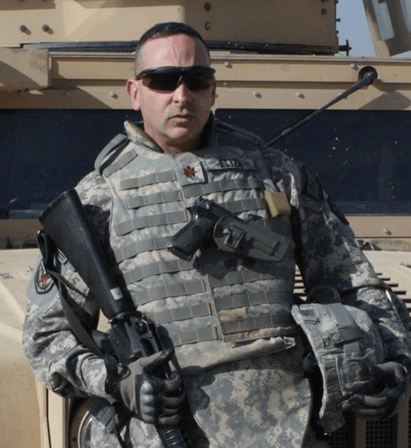 Raúl in front of a tank