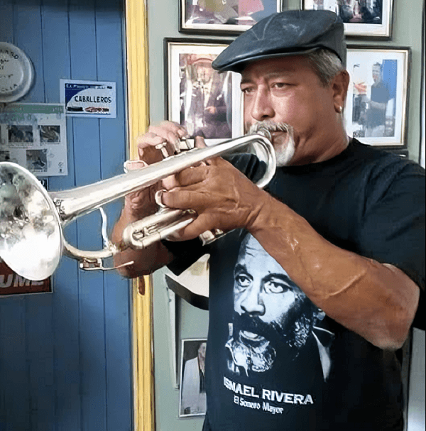 Tito Rivera playing the trumpet