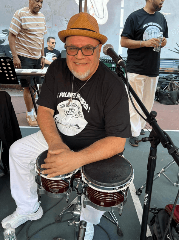 Ray playing the bongo
