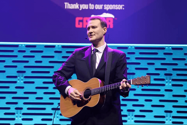 Zach playing the guitar at the NAMM Show